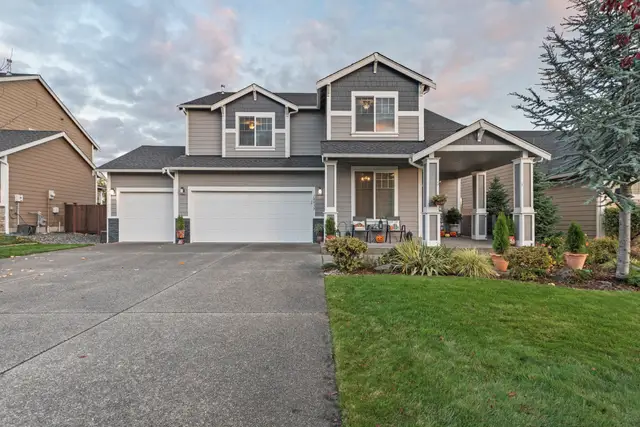 Two-story house with a new grey roof